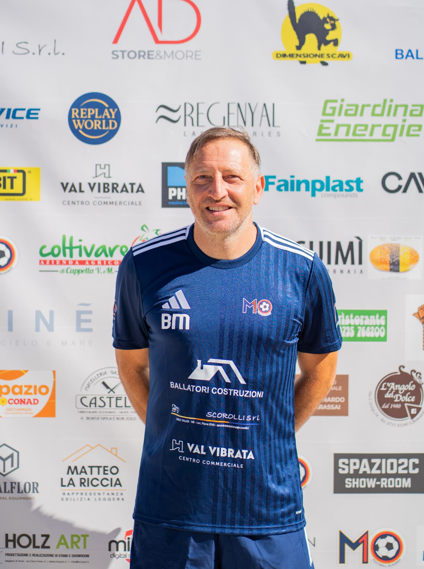 Ritratto ufficiale di Marco Bucci, staff tecnico M10